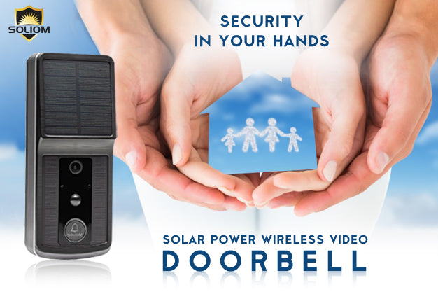 Solar-powered wireless video doorbell beside hands holding a blue paper house with family icons, security concept