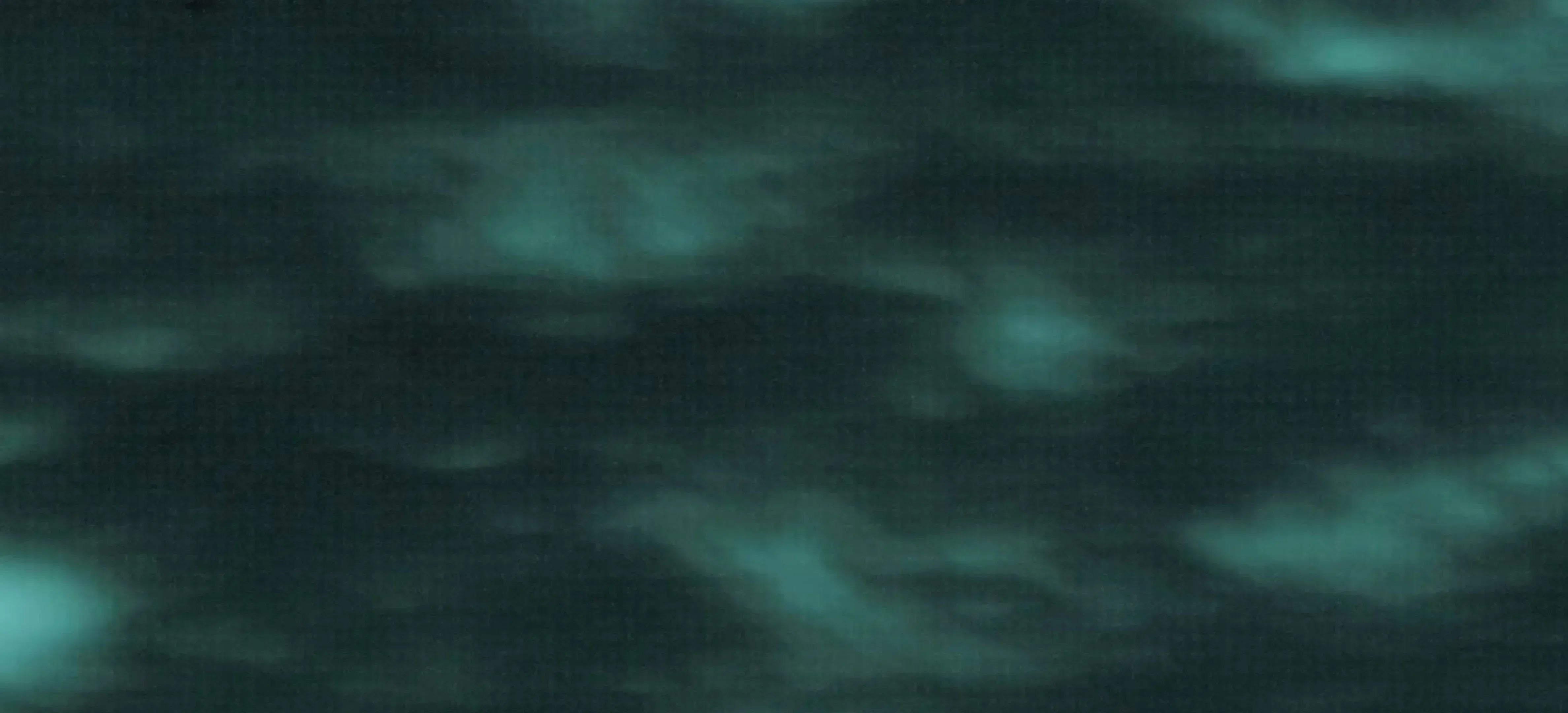 Dark green cloudy night sky with soft glowing patches, simulating night vision effect