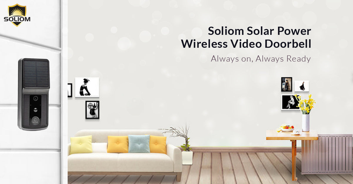Soliom solar-powered wireless video doorbell mounted on white wall with modern living room background