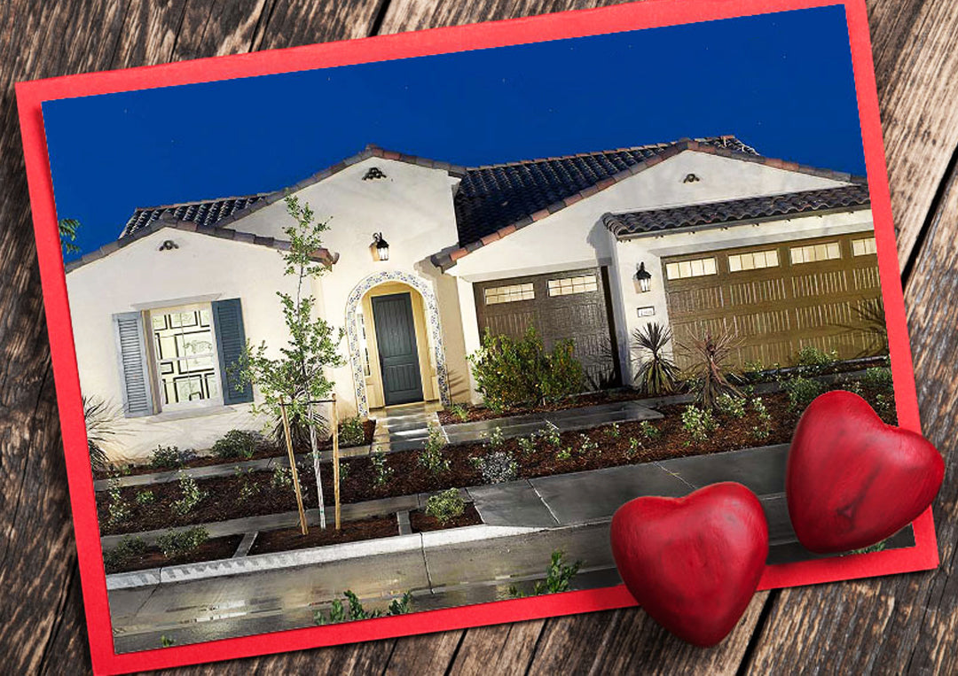 Photo of a modern white stucco house with tiled roof, double garage, and landscaped front yard on wood background with red hearts