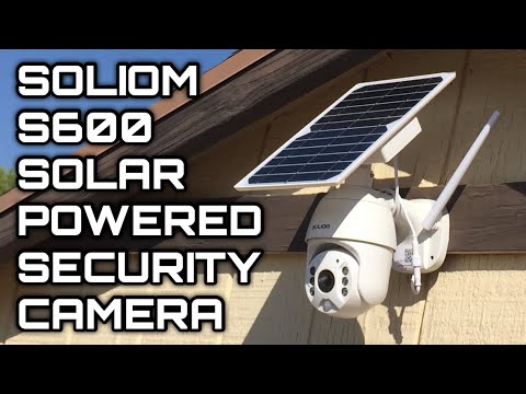 Solar-powered Soliom S600 security camera mounted on outdoor wooden wall under roof